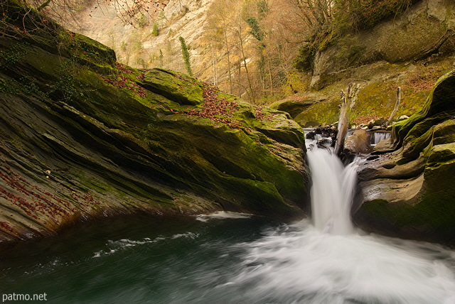 Photo of a powerful waterfall in river Cheran