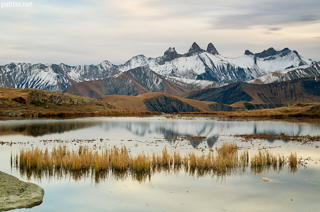 Picture of an autumn evening around lake Guichard with a view on Aiguilles d'Arves mountains